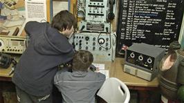 Zac and Ash try out the maritime communication equipment at the Shipwreck Heritage Centre, Charlestown